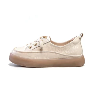 Close-up of leather upper and thick sole on women off-white platform sneakers