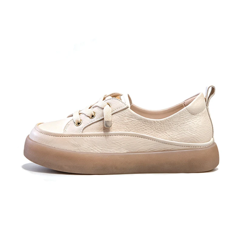 Close-up of leather upper and thick sole on women off-white platform sneakers